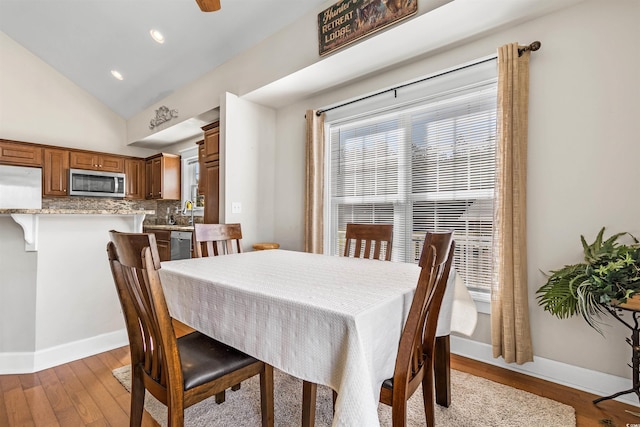 2580 Ash Little River Rd, Ash, NC 28420 - dining space featuring light wood-style flooring, vaulted ceiling, baseboards, and recessed lighting