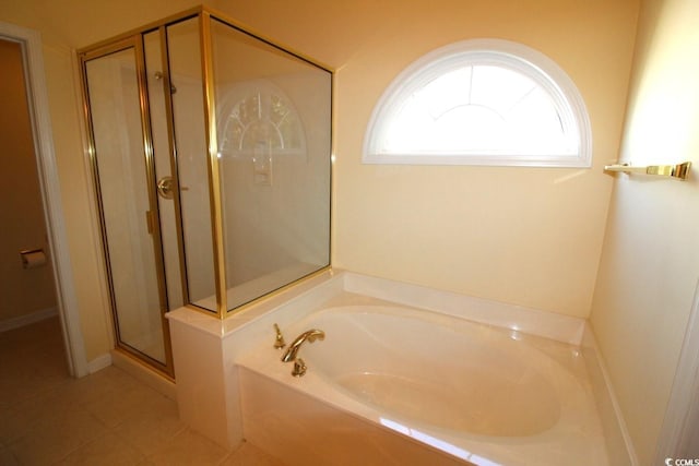 bathroom with tile patterned flooring and independent shower and bath