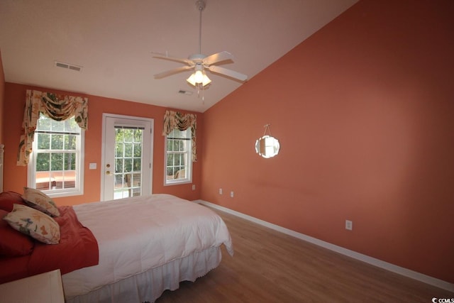 bedroom featuring access to exterior, wood-type flooring, vaulted ceiling, and ceiling fan