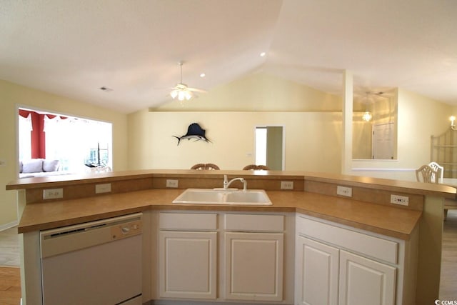 kitchen featuring white cabinets, ceiling fan, sink, dishwasher, and lofted ceiling