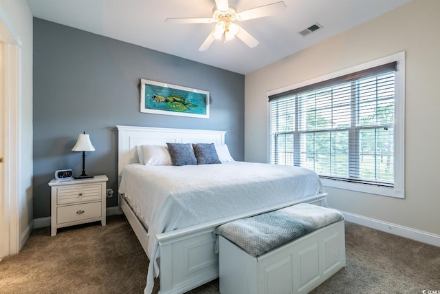 bedroom featuring dark colored carpet and ceiling fan