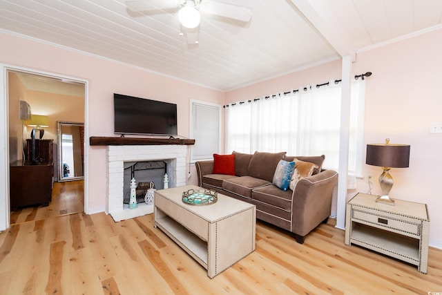 114 N Pinewood Dr N, Surfside Beach, SC 29575 - living room featuring crown molding, a brick fireplace, light wood finished floors, and ceiling fan