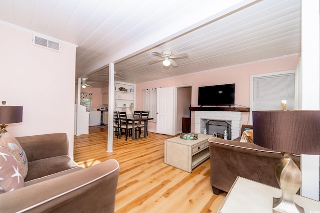 114 N Pinewood Dr N, Surfside Beach, SC 29575 - living room with light wood-type flooring, visible vents, ceiling fan, and ornamental molding