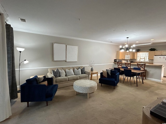 carpeted living room featuring crown molding and a chandelier