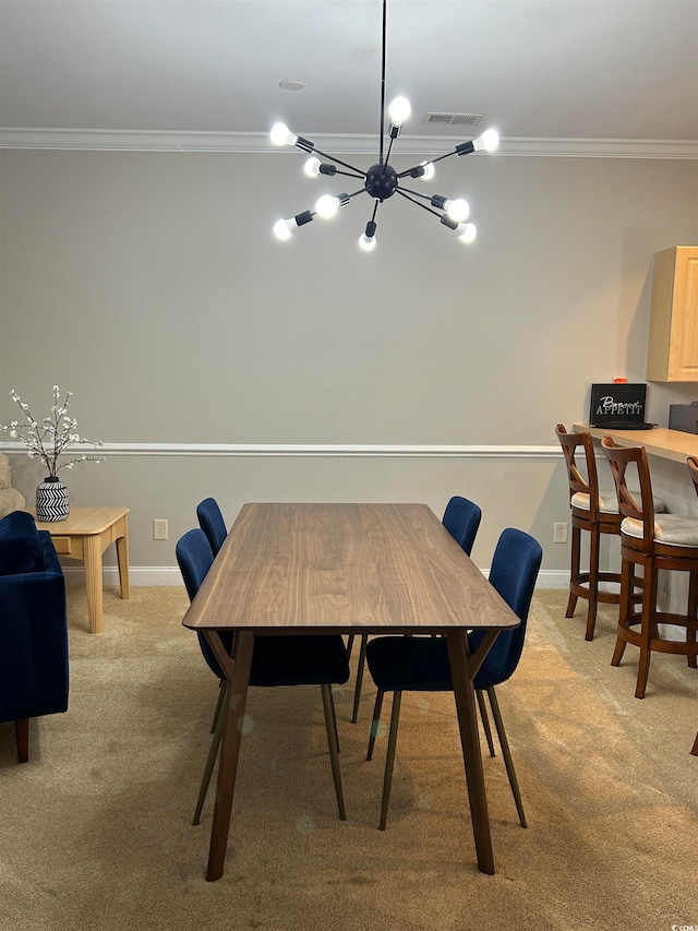 carpeted dining area with a notable chandelier and ornamental molding