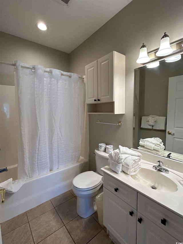 full bathroom with tile patterned flooring, shower / tub combo, vanity, and toilet