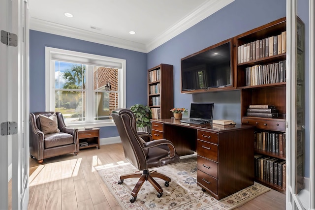 home office with crown molding and light wood-type flooring