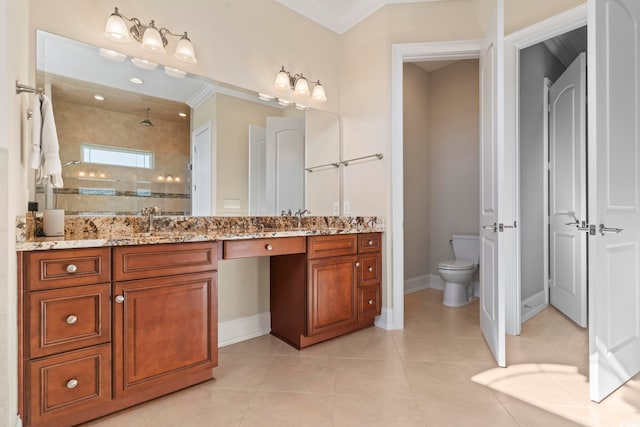 bathroom with tile patterned flooring, vanity, tiled shower, toilet, and crown molding