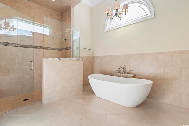 bathroom with tile patterned floors, independent shower and bath, tile walls, and a wealth of natural light