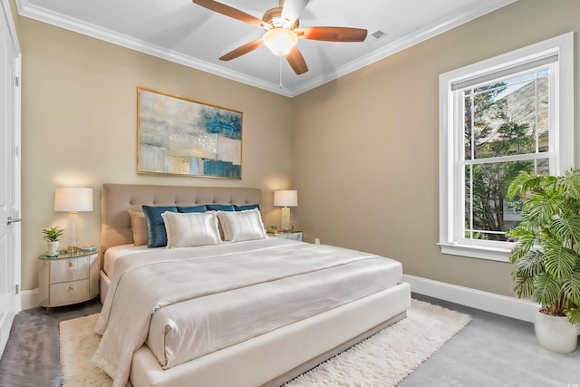 carpeted bedroom featuring crown molding and ceiling fan