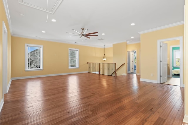 unfurnished living room featuring crown molding, wood-type flooring, and ceiling fan