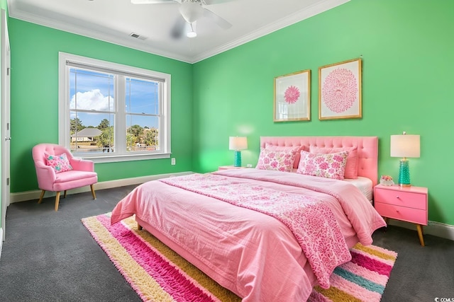 bedroom with ceiling fan, ornamental molding, and dark carpet