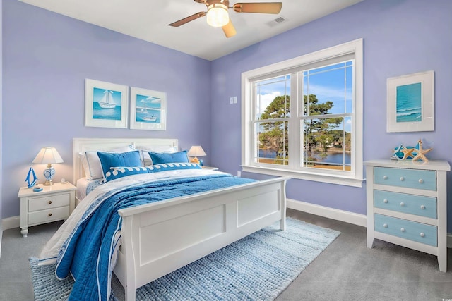 carpeted bedroom featuring ceiling fan