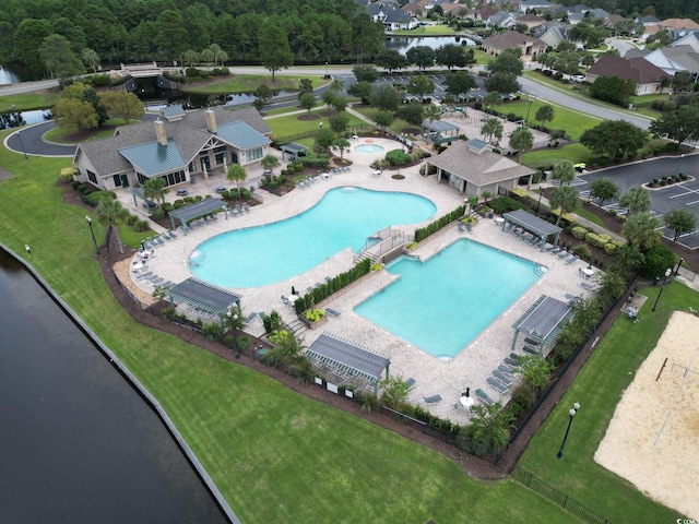 birds eye view of property with a water view