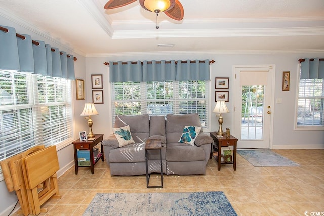 living room featuring ceiling fan, ornamental molding, and light tile patterned floors