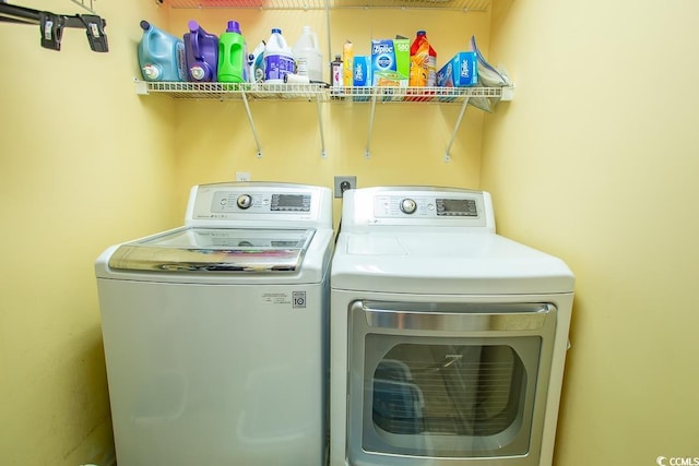 washroom with washer and dryer