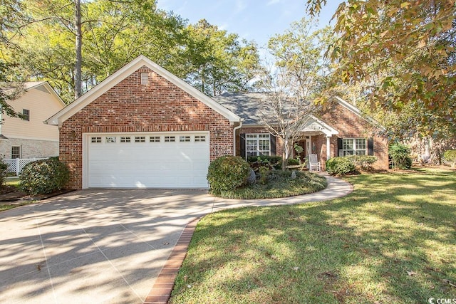 view of front of property featuring a garage and a front lawn