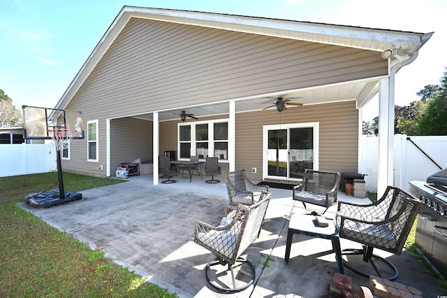 back of property featuring a patio and ceiling fan