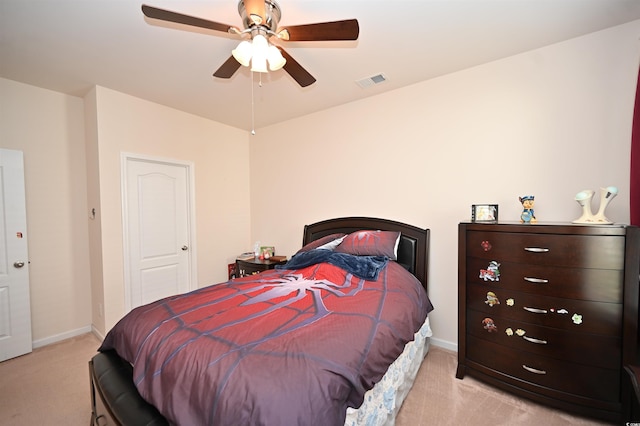 carpeted bedroom featuring ceiling fan