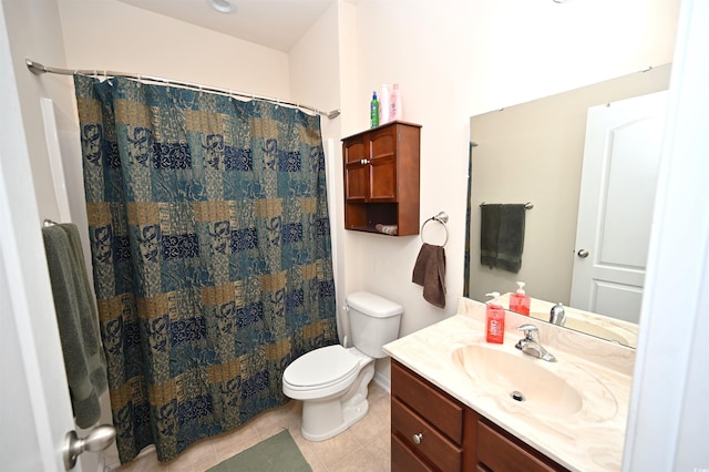 bathroom featuring tile patterned flooring, vanity, curtained shower, and toilet