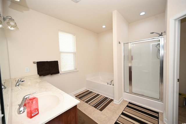 bathroom featuring vanity and shower with separate bathtub