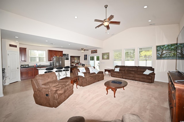 living room with light colored carpet and ceiling fan