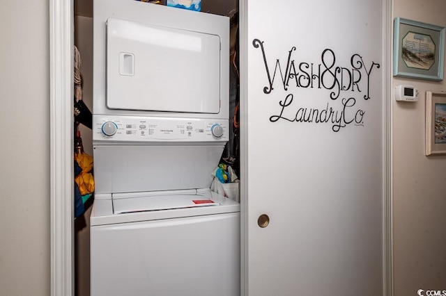 laundry room featuring stacked washing maching and dryer