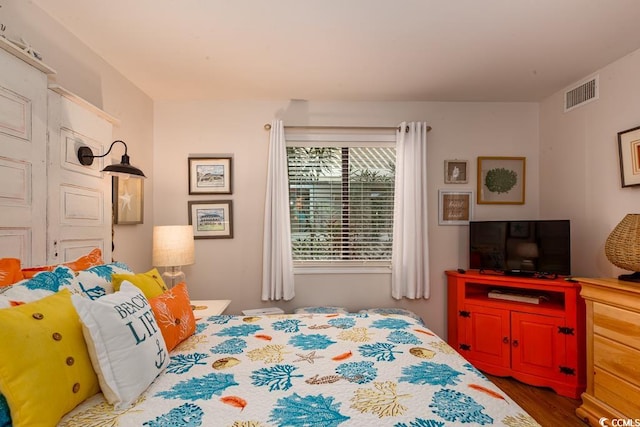 bedroom featuring dark wood-type flooring