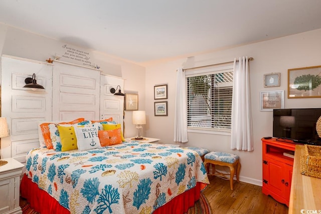 bedroom featuring dark hardwood / wood-style flooring