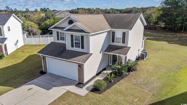 front facade with a garage and a front lawn