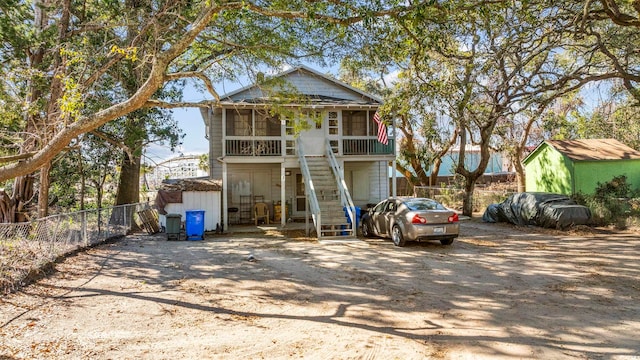 view of front facade with a sunroom