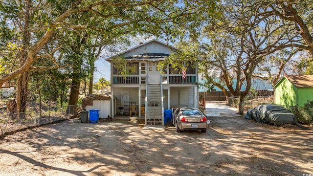 view of front of property featuring a sunroom