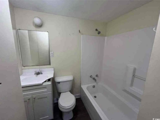 full bathroom featuring shower / bath combination, vanity, and toilet