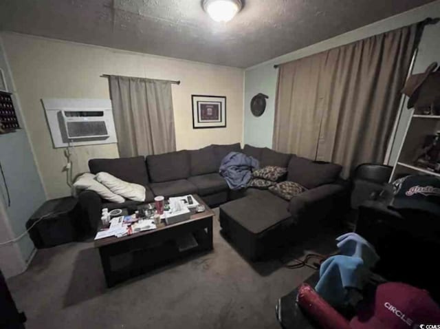 living room featuring carpet floors, an AC wall unit, and a textured ceiling