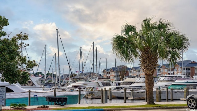 view of property's community with a dock