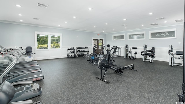 exercise room featuring ornamental molding