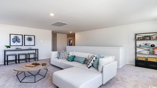 living room featuring light carpet