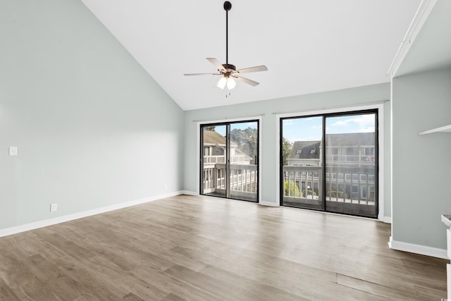 unfurnished room with ceiling fan, hardwood / wood-style floors, and high vaulted ceiling