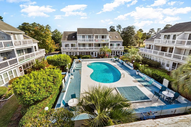 view of swimming pool with a patio