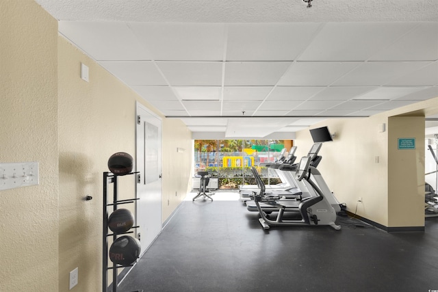 workout area with a drop ceiling