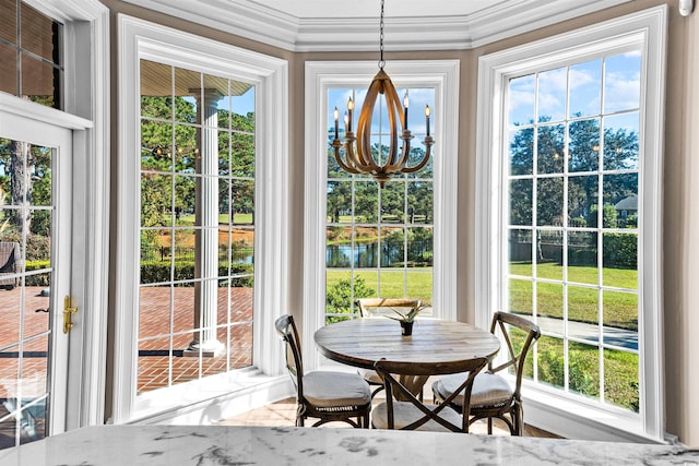 sunroom / solarium featuring an inviting chandelier