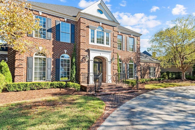 3754 Annandale Dr, Myrtle Beach, SC 29577 - colonial house featuring brick siding and roof with shingles