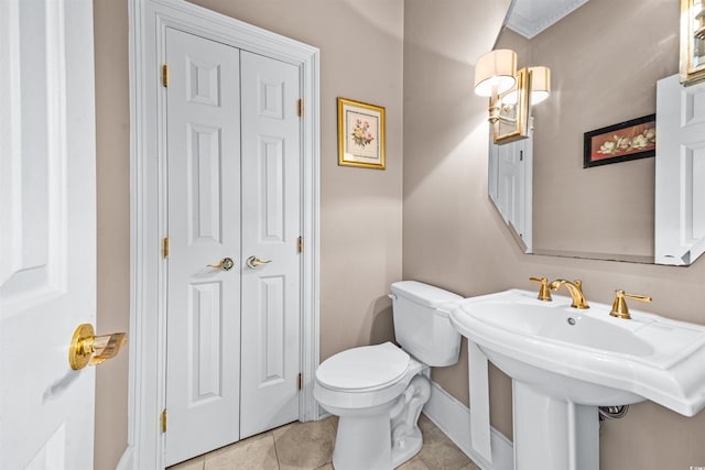 bathroom featuring tile patterned floors, sink, and toilet