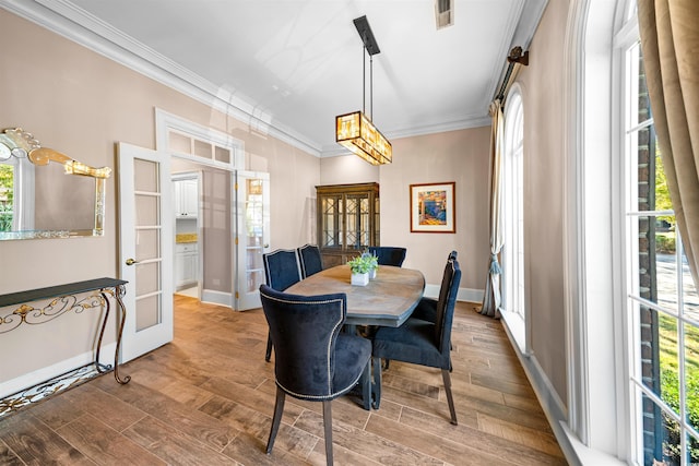 3754 Annandale Dr, Myrtle Beach, SC 29577 - dining space featuring french doors, ornamental molding, and wood finished floors