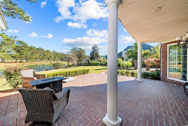 view of patio featuring a water view