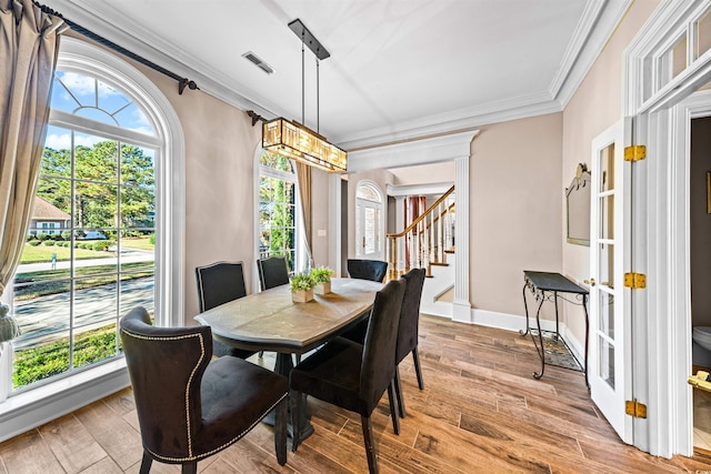 3754 Annandale Dr, Myrtle Beach, SC 29577 - dining area with crown molding, stairway, and wood finished floors
