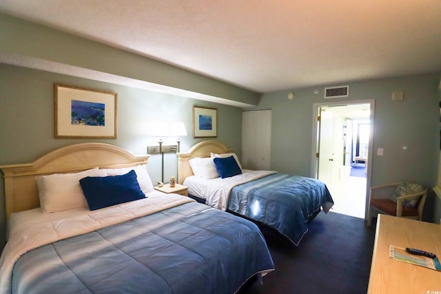 bedroom featuring carpet floors and a closet