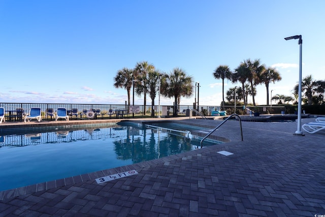 view of pool featuring a patio area