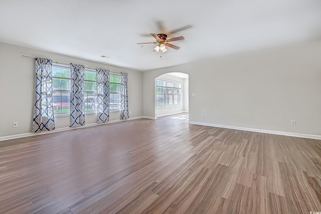 spare room featuring hardwood / wood-style flooring and ceiling fan