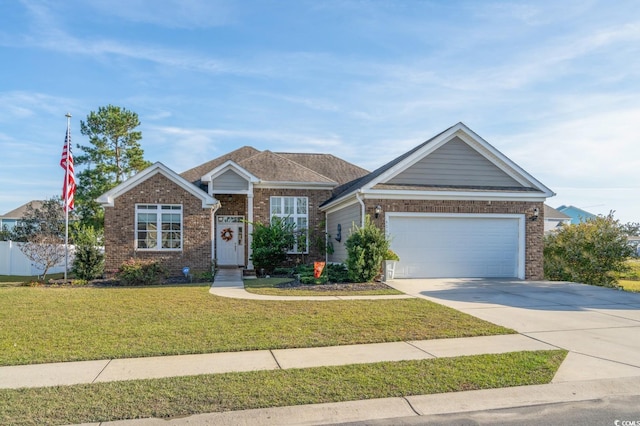 view of front of house with a garage and a front lawn